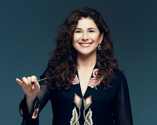 Elena Sharkova conducting with baton